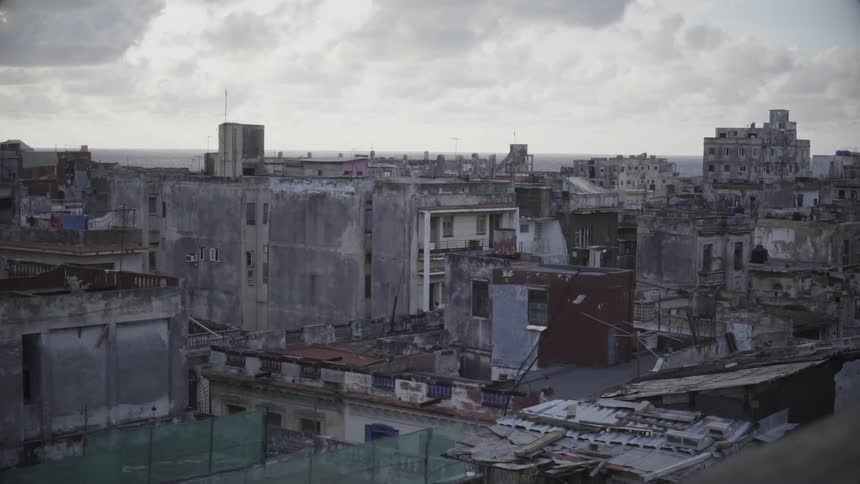 Run down and damaged buildings line the skyline