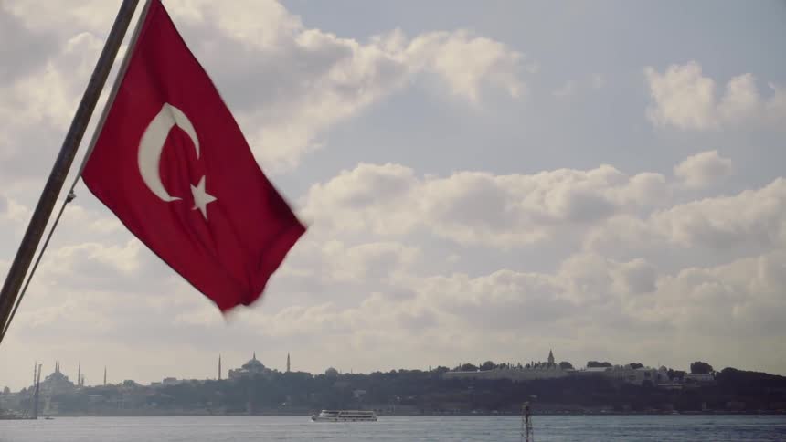 The turkish flag waves in the wind
