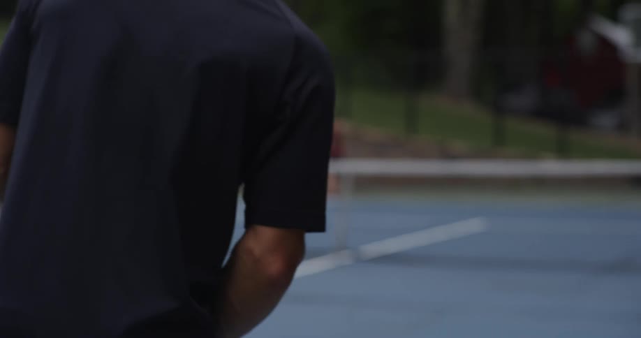 Two people play tennis