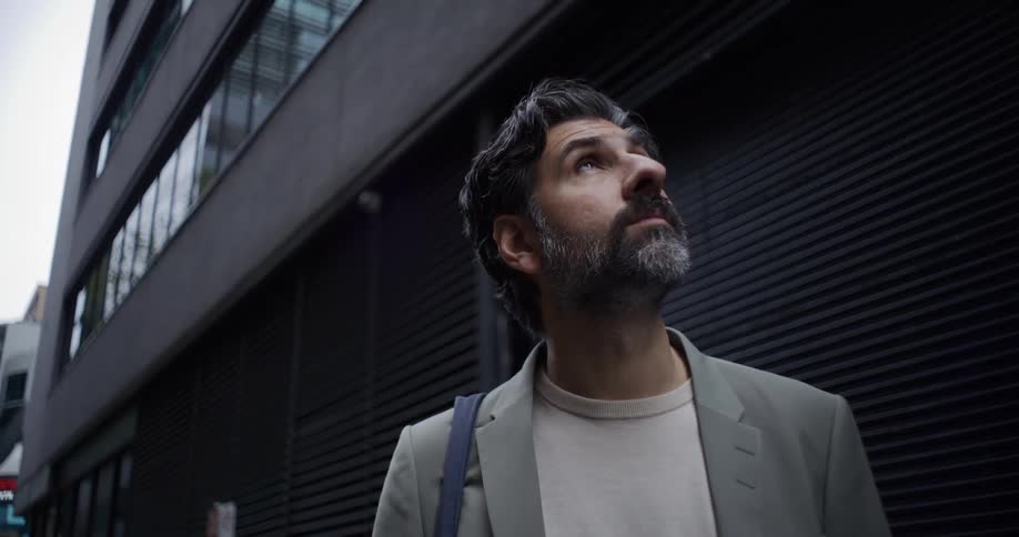 A man looks up towards the sky