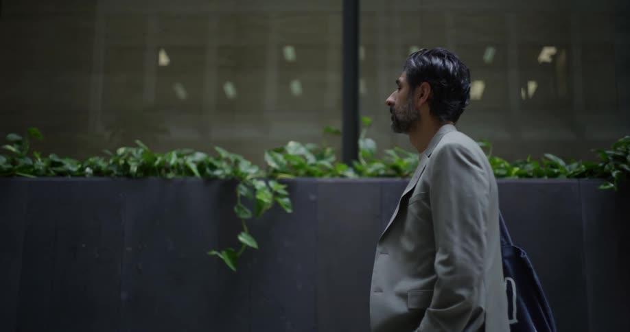 A man is walking through the city