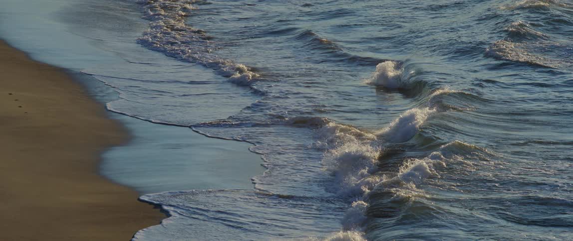 Waves crash upon the shore