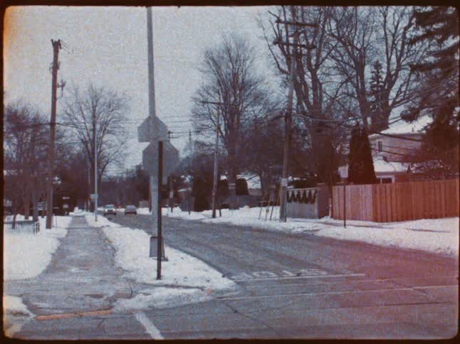 Crossing a street in an urban city with snow