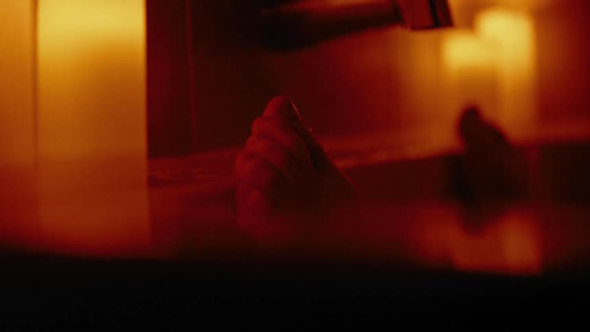 Close up of a persons feet in a bathtub