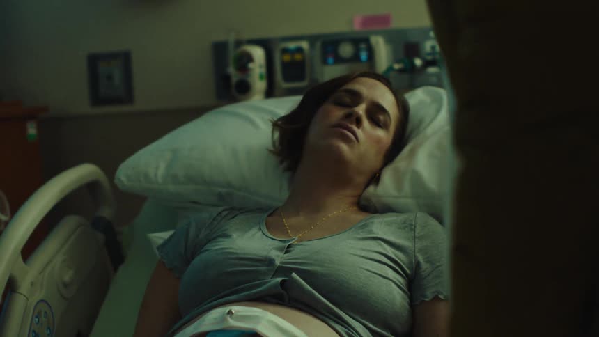 Woman lying in a hospital trying to stay calm while in labor