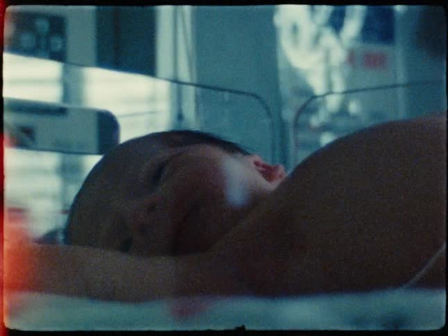 Newborn baby lying on a stretcher in the hospital