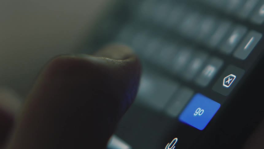 Close up of persons hand texting on smartphone