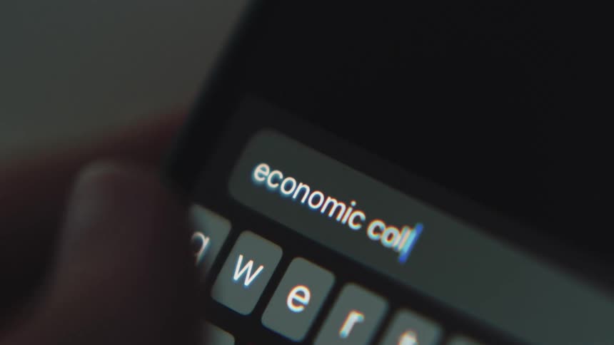 Person enters word via digital keyboard on smartphone