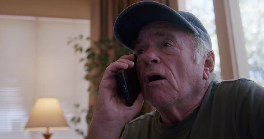 An elderly person talking on the cellphone
