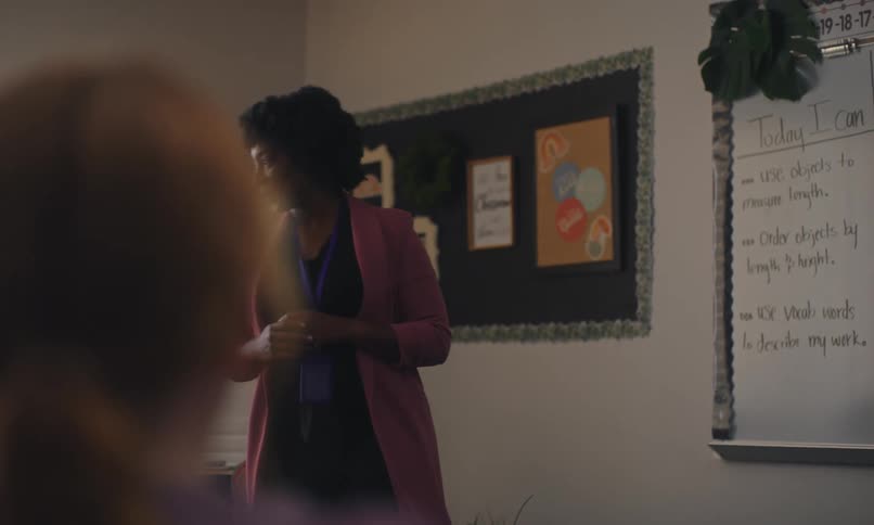Teacher teaching a class to students