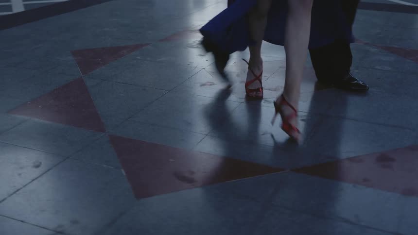 Two people dance but you only see their legs