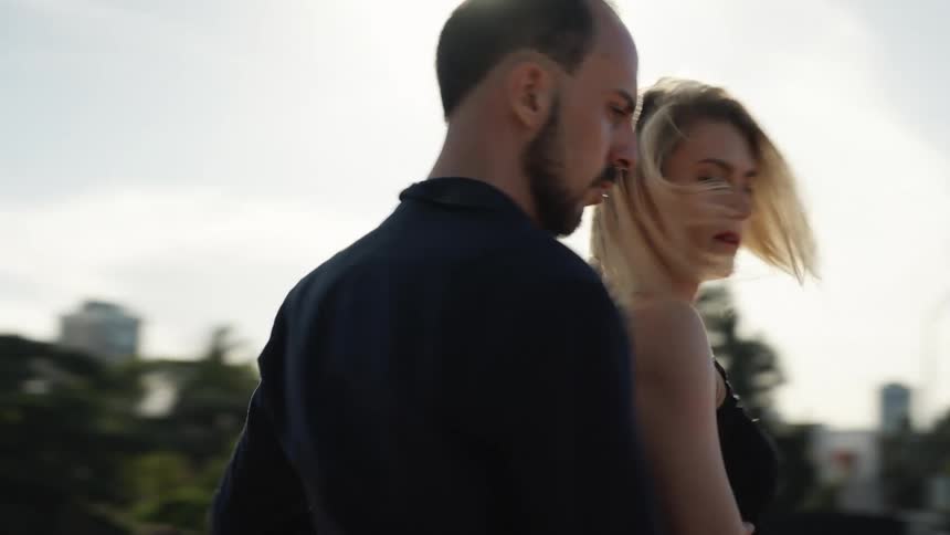 Man and woman dancing tango in a public space
