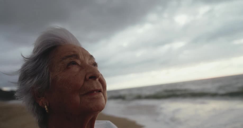 Portrait of an elderly woman on the beach