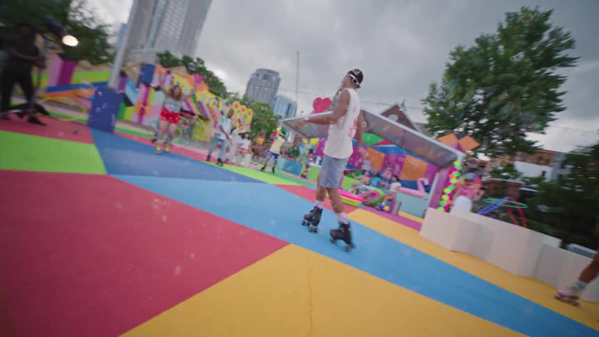 People on roller skates riding on a colorful playground