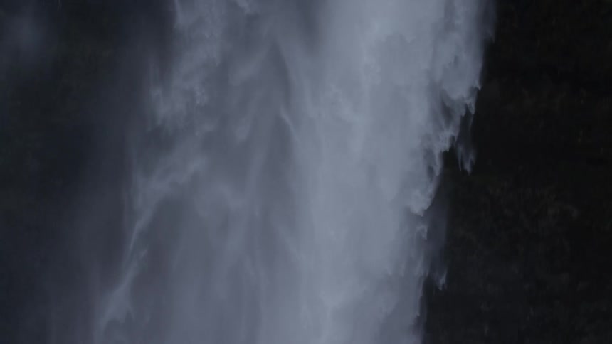 Strong waterfall falling free from a cliff