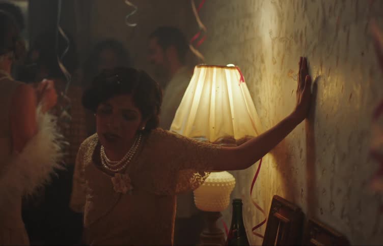 Stumbling woman leaves a party crying