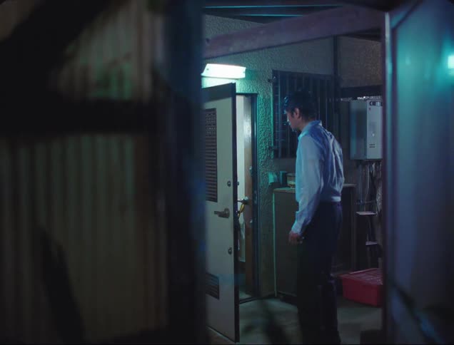 A man goes inside from the rain