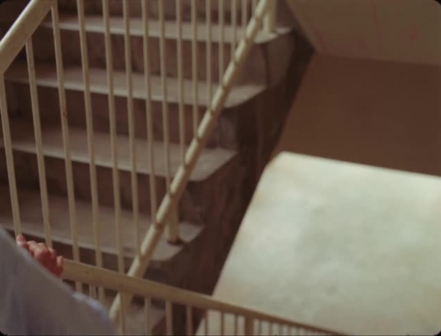A man climbs up the stairs