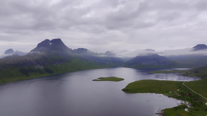 A large lake is on the side of the mountain
