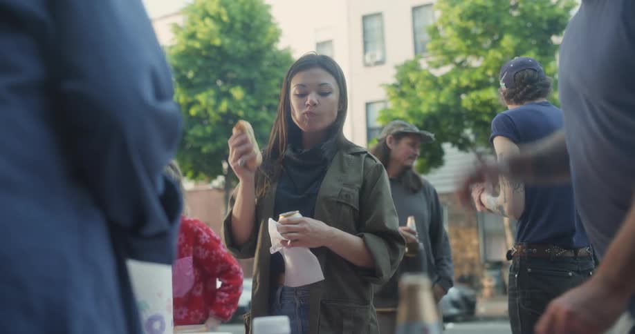 People are eating barbecue outside together