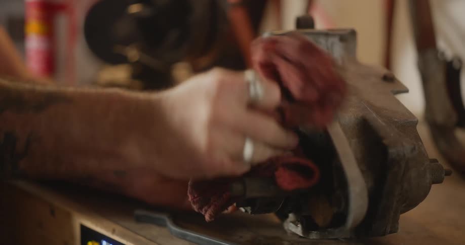 A man is cleaning a motor