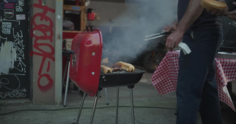 Smoke rises from the barbecue grill