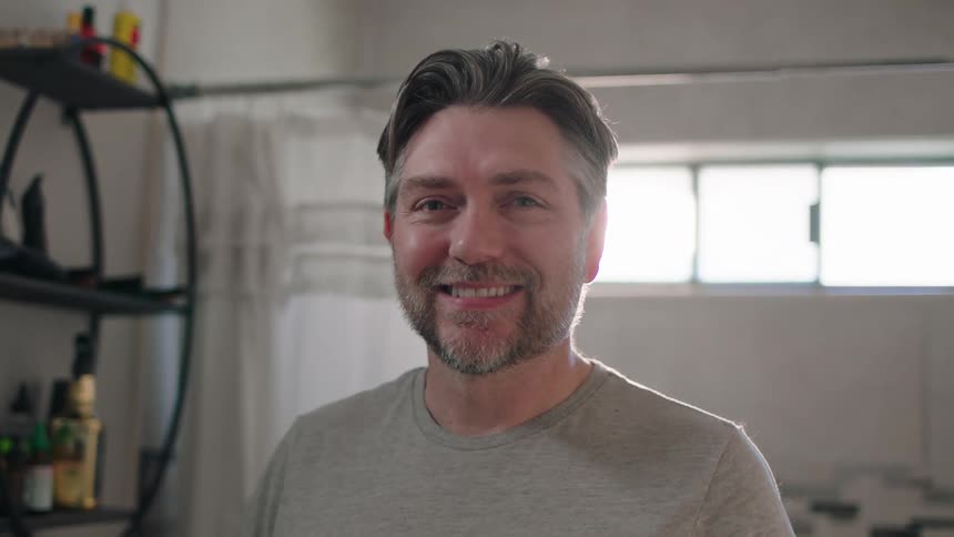 Man giving a smile while in the bathroom