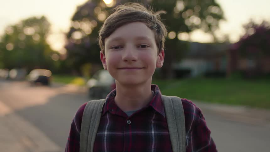 A child smiles on the road