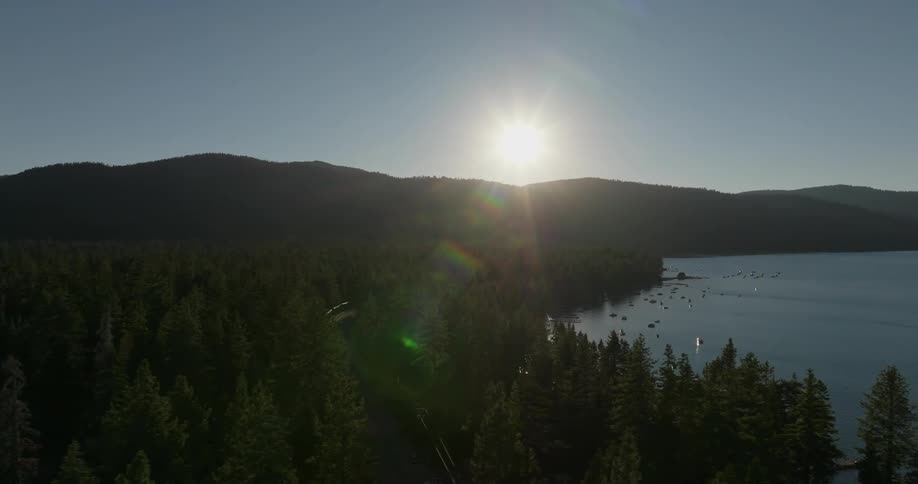The sun sets near a lake