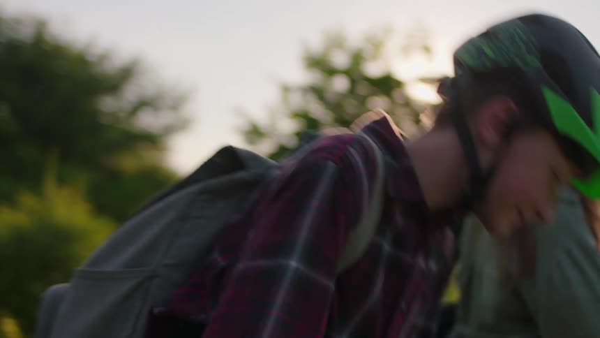 Mother and son hugging and each going their separate ways