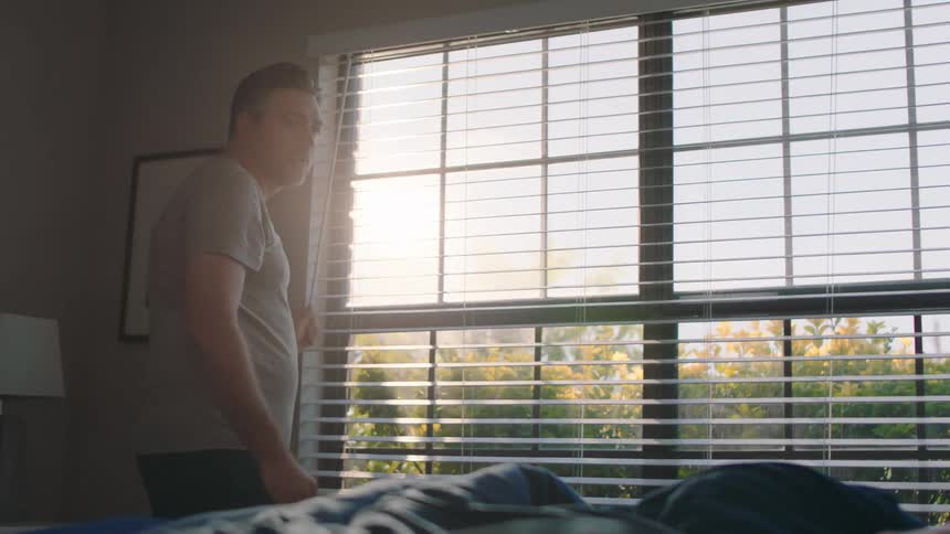 Father waking up his son