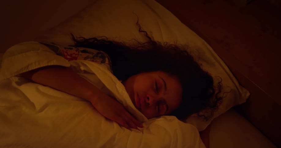 Curly haired woman sleeping