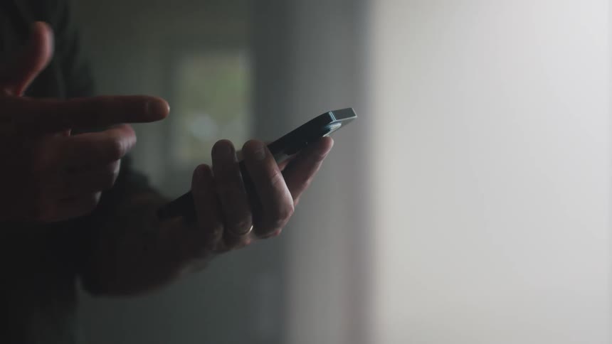A man tests an app on a smartphone