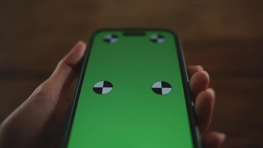 A person is holding their cellphone in their hand