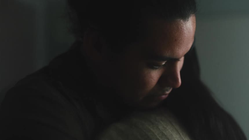 Two people are hugging