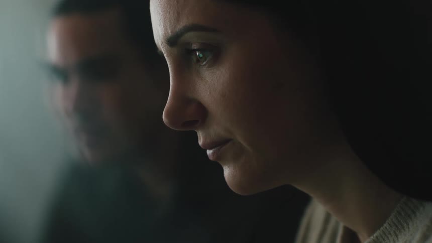 A man and a woman with sad expressions both focusing their eyes in the same direction the reason for their sadness is unknown but their shared expression creates a feeling of empathy and compassion