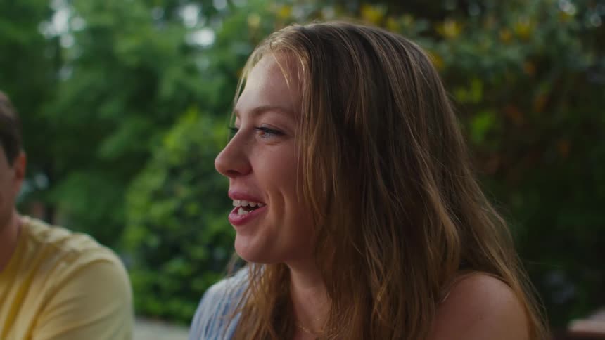 A woman is talking with friends