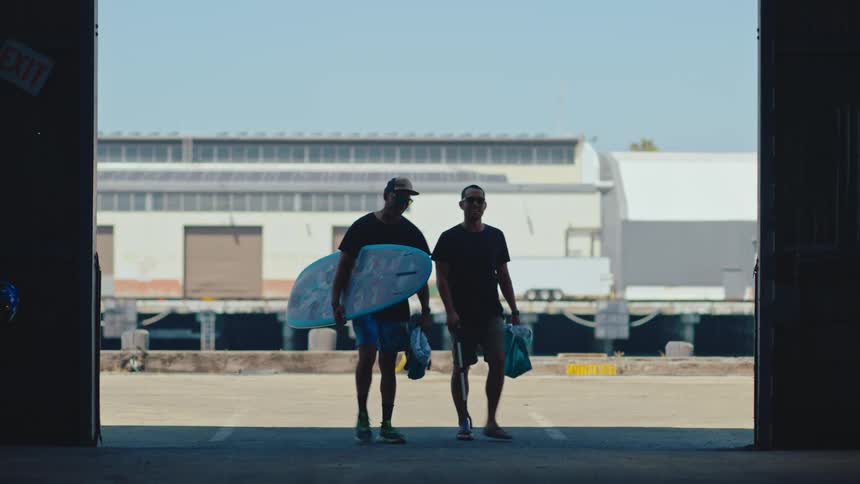 Two men walk into the garage