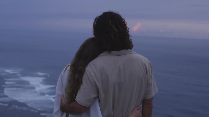 A couple hug on the beach