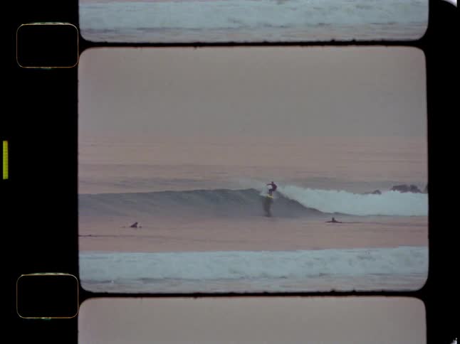 People at sea surfing waves