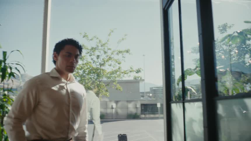 Man inside an office room with a serious facial expression