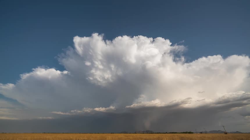 Storm clouds flow over the field