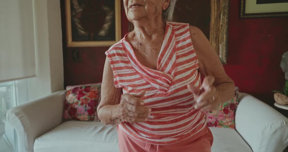 Two women are dancing at home