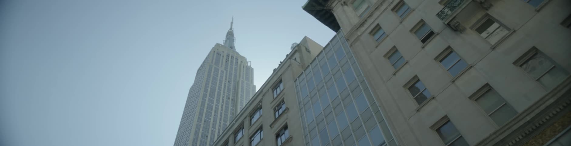 A city skyline being filmed from the street