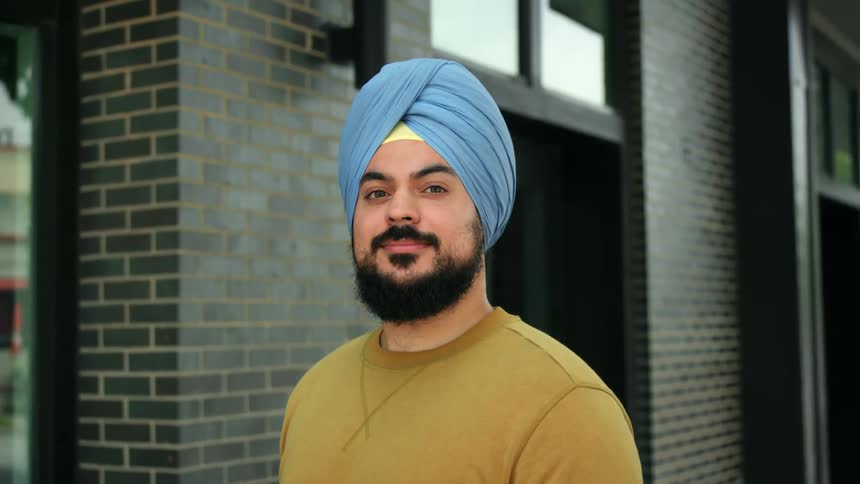 A man is wearing a turban