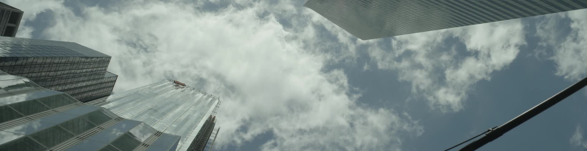 Clouds over skyscrapers in a city during the day