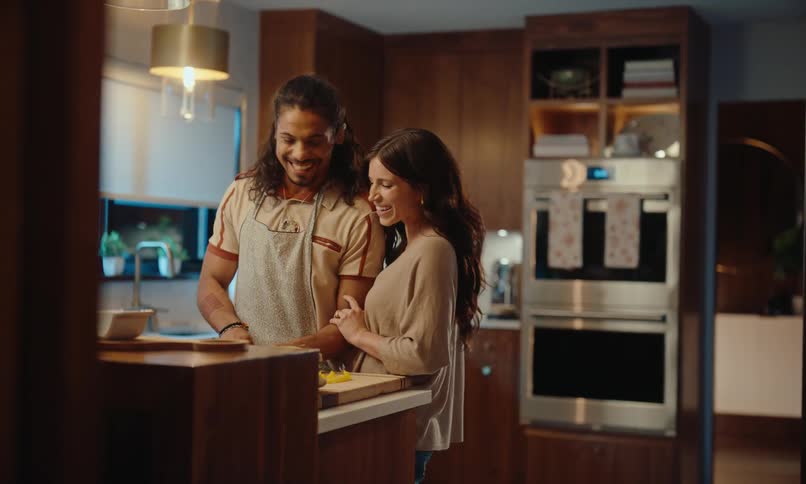 Couple in the kitchen preparing dinner