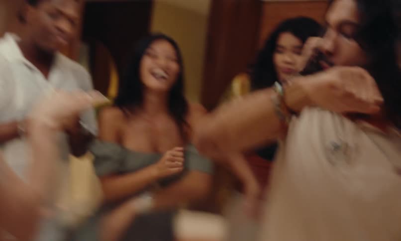 Group of friends at a party having fun and dancing