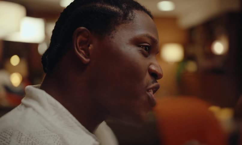 Man smiling and talking in an restaurant