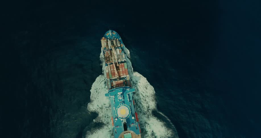 A freight ship travels in the ocean